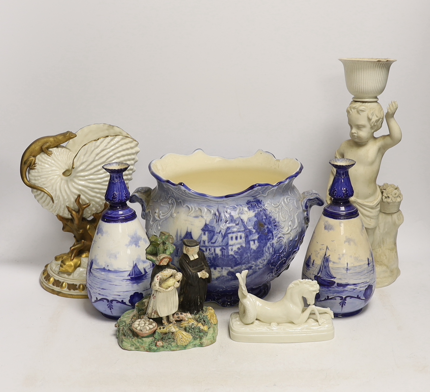 A 19th century Staffordshire Tithe Pig group, a pair of Royal Crown Derby blue and white vases, a Royal Worcester nautilus shell centrepiece and three other items, 32cm high